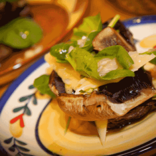 Grilled Portobello Mushrooms with Fresh Baby Spinach and Shaved Manchego Cheese