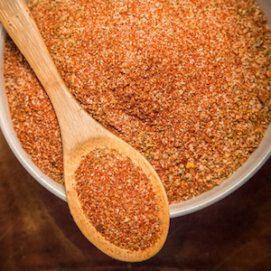 Shows a bowl and wooden spoon filled with My Sage Gourmet Southwest Seasoning Blend