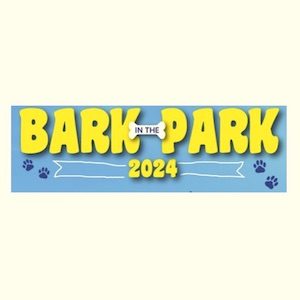 Shows the words Bark in the Park 2024 in yellow on a blue background with two sets of doggie prints